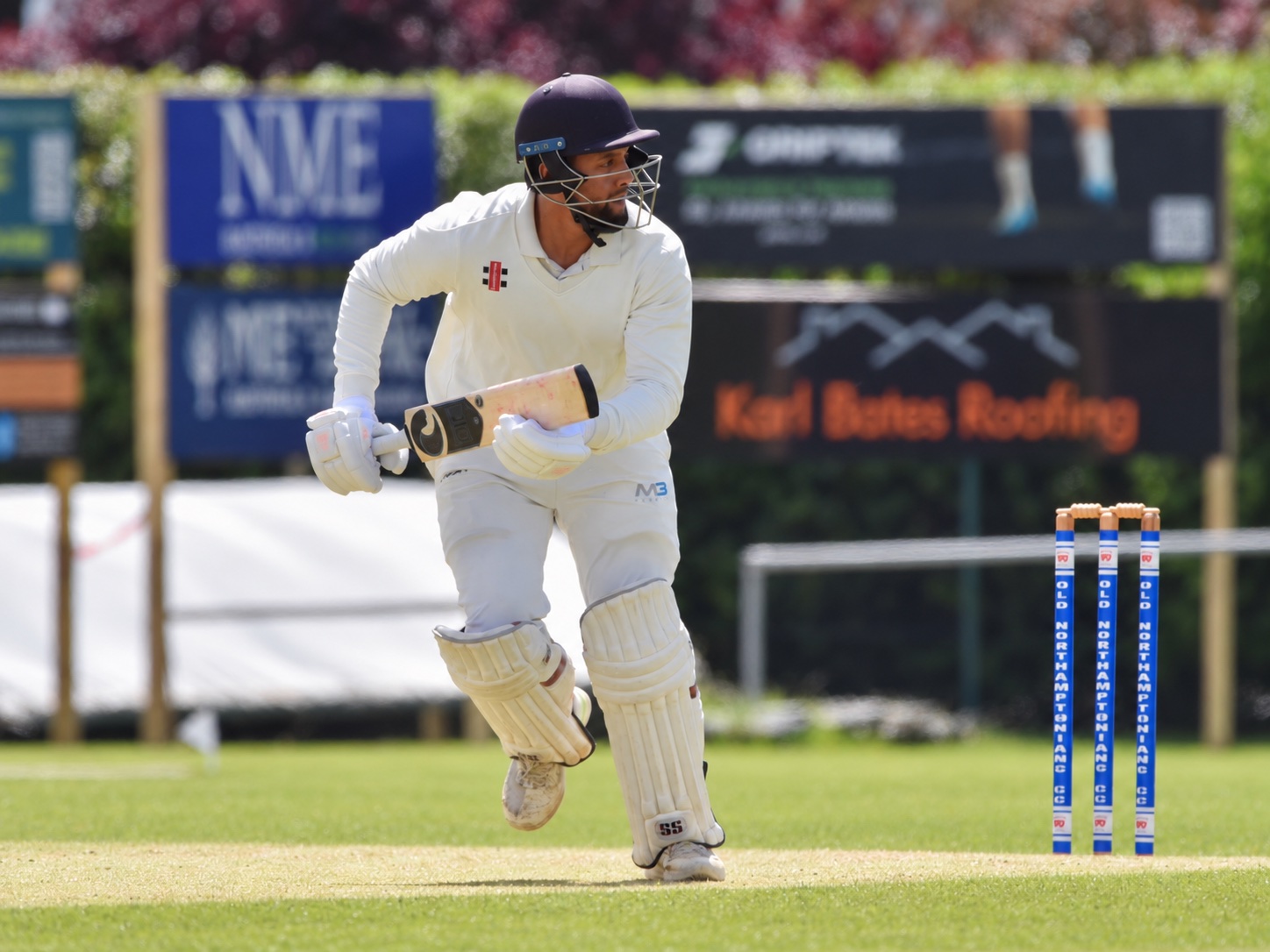 A batter at the crease during a cricket match